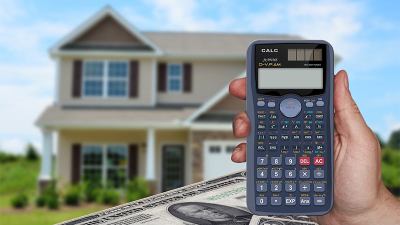 Calculator with home in background